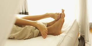 Couples Feet in Bed